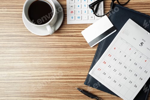 Preview: Morning routine with coffee, calendar, and workspace on a wooden table