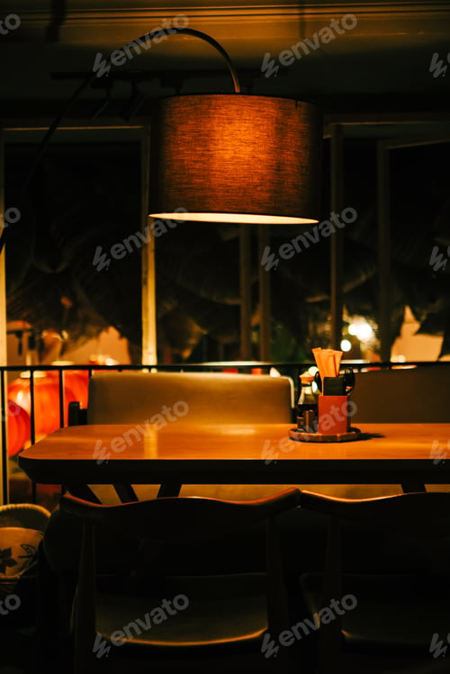 Preview: Empty table in restaurant at the evening.