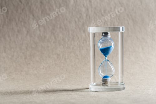 Preview: Close up hourglass on table