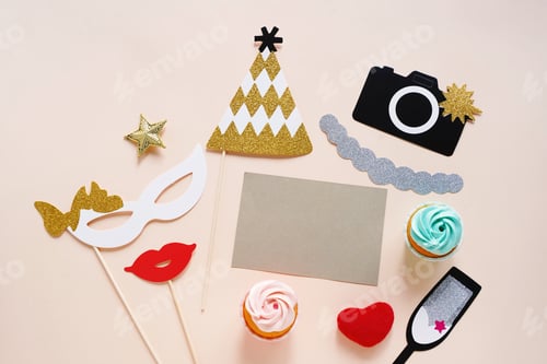 Preview: Cute party props and cake with blank card on yellow background. Birthday, wedding party celebration
