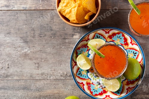 Preview: Homemade michelada cocktail with beer, lime juice,hot sauce,salted rim and tomato juice
