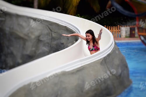Preview: Happy girl on a water slide