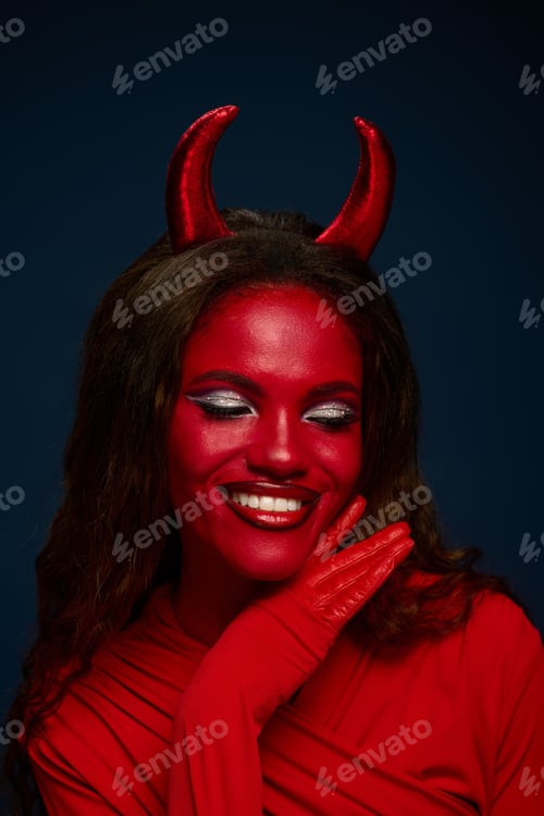 Preview: Beautiful woman in a captivating Halloween devil costume, embracing the festive spirit with flair