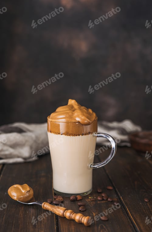 Preview: Vertical shot of delicous foamy and creamy trendy whipped coffee Dalgona