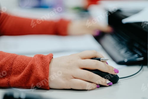 Preview: Young female working on the computer in a company