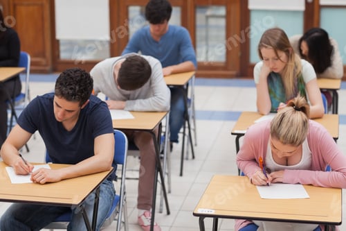 Preview: Students Sitting A Test In An Exam Hall In College