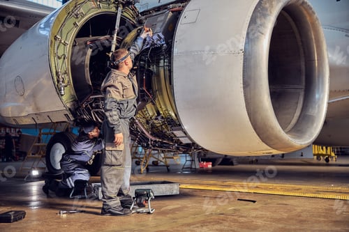 Preview: View of airplane and engine mechanisms on the wing in the indoors