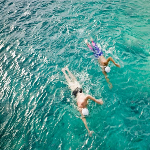 Preview: Men swimming in sea