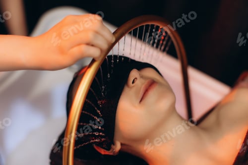 Preview: Woman receiving relaxing head spa water therapy. Japanese spa head