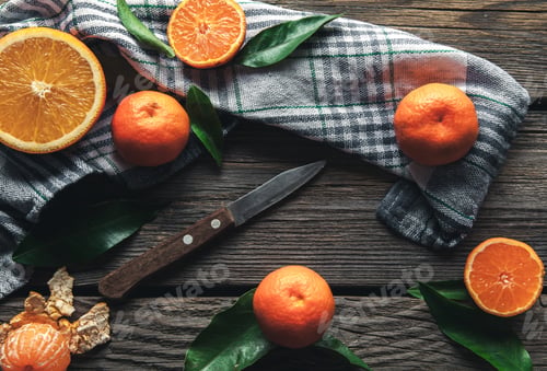 Preview: tangerines with a knife on a wooden background. Healthy food. Fruit