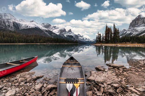 Preview: Canoe anchored on Spirit Island with Canadian Rockies in Maligne Lake at Jasper national park