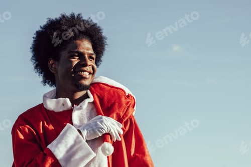 Preview: African american santa claus over sky background