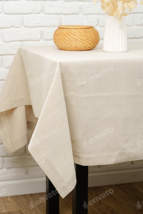 Preview: White Brick Wall With Beige Tablecloth and Basket