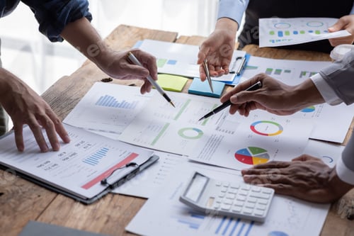 Preview: Group of confident business people point to graphs and charts to analyze market data, balance sheet,