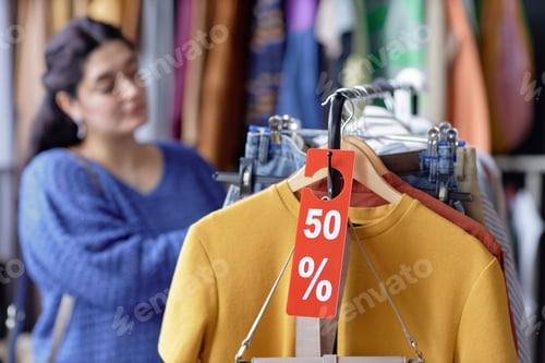 Preview: Fifty Percent Discount Red Tag on Second Hand Clothes at Thrift Store