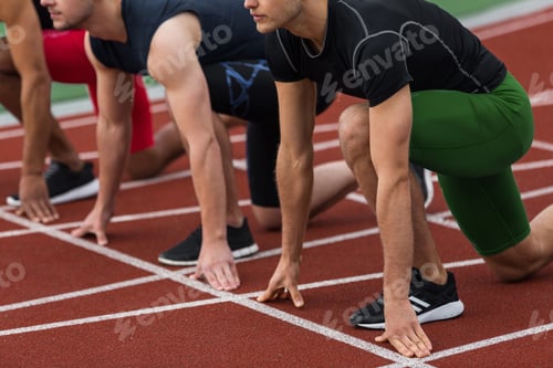 Preview: Cropped picture of multiethnic athlete group ready to run