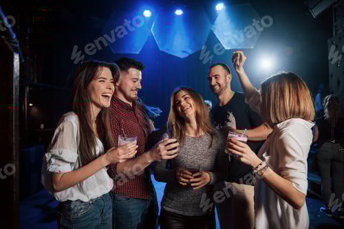 Preview: Girl is too shy to dance. Beautiful youth have party together with alcohol in the nightclub
