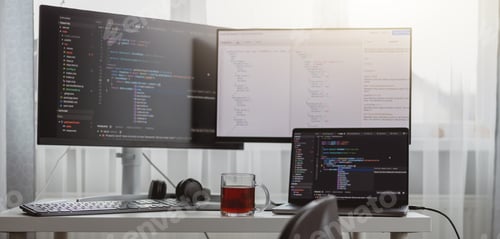 Preview: Interior shot. Workplace of a programmer, IT job, home, Computer monitors and laptop on desk
