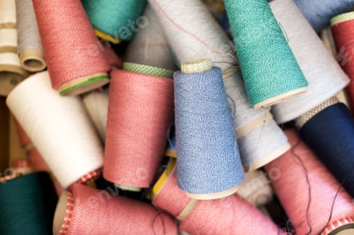 Preview: Full frame background texture of cashmere wool on spools