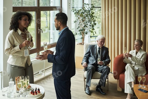 Preview: Diverse Business Professionals Networking during Corporate Social Event Indoors