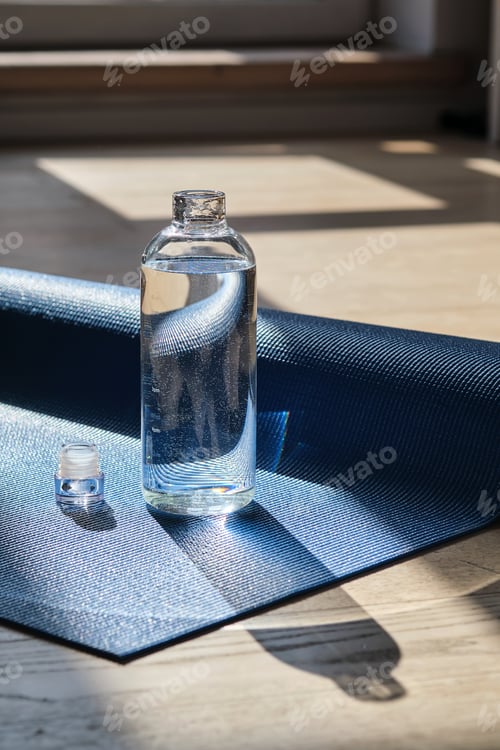 Preview: Water Bottle on a Blue Yoga Mat