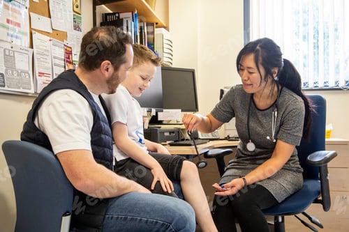 Preview: Healthcare professional conducting a checkup with a young patient