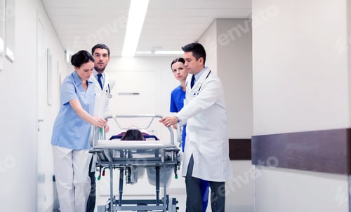 Preview: medics with woman on hospital gurney at emergency