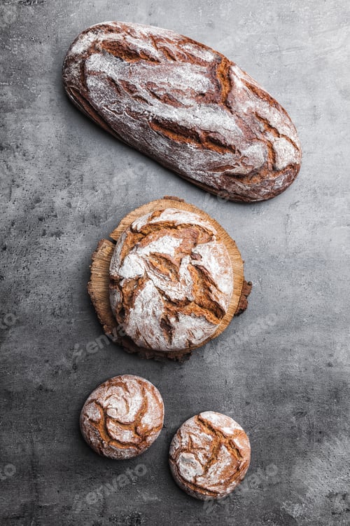 Preview: Delicious fresh bread on rustic background