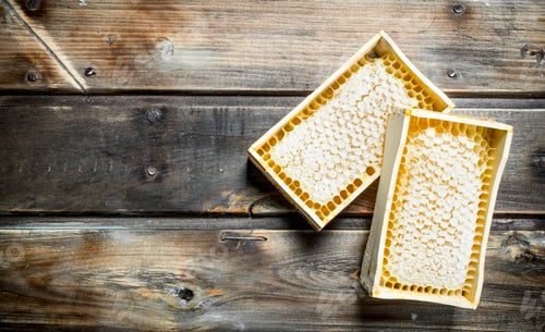 Preview: Honey in wooden honeycombs.