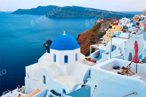 Preview: Famous view from viewpoint of Santorini Oia village with blue dome of greek orthodox Christian