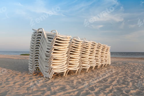 Preview: Stacked Lounge Chairs on a Beach