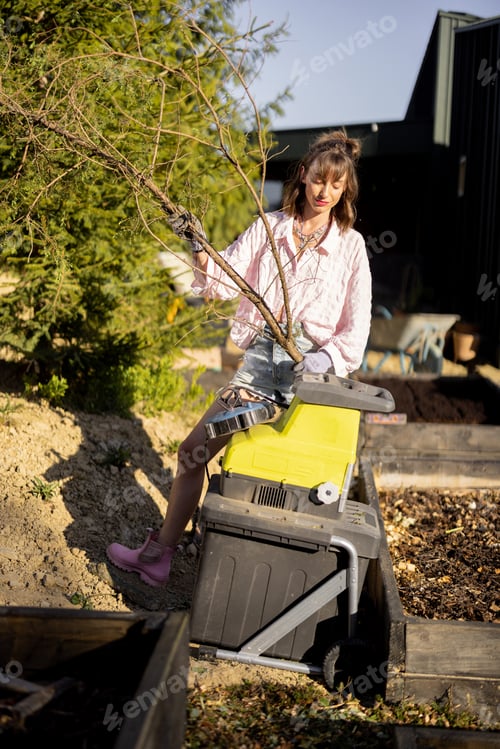 Preview: Woman works at backyard garden