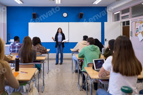 Preview: Teacher explaining lesson to students in classroom at high school