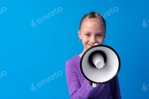 Preview: Child girl using megaphone against blue background