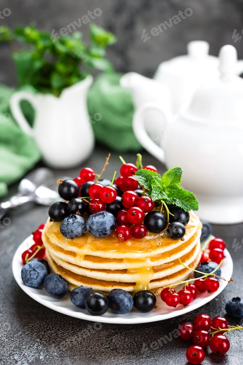 Preview: Pancakes with fresh berries. Pancakes with raspberry, blueberry, redcurrant, black currant and honey