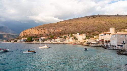 Preview: Greece. Limeni port, Mani Lakonia, Peloponnese. Stone building, fishing boat, Mediterranean sea.