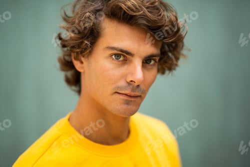 Preview: Handsome young man staring at camera