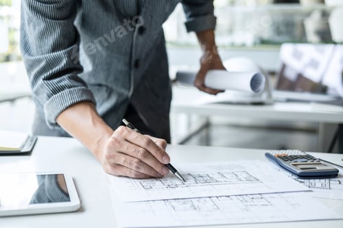 Preview: Architect working on blueprint