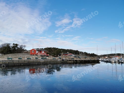 Preview: Beautiful shot of vintage houses near a lake in Larvik, Norway