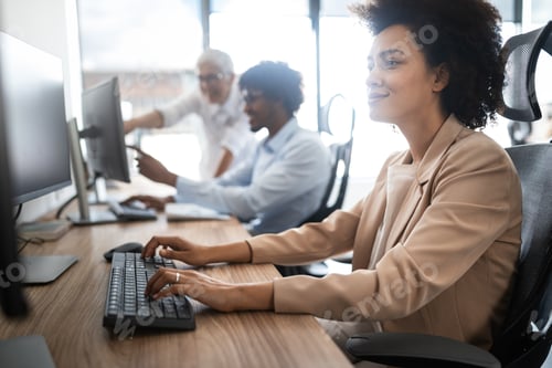 Preview: Successful group of business people at work in office