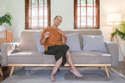 Preview: Elderly Woman Taking Care of Her Health at Home, Practicing Mindfulness and Relaxation on a