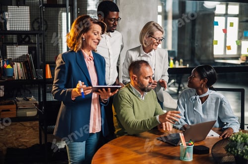 Preview: Multiracial colleagues in a boardroom discussing business together