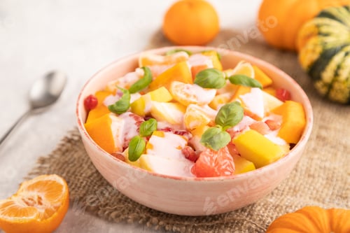Preview: Vegetarian fruit salad of yogurt pumpkin, tangerine, pomegranate, grapefruit, basil microgreen