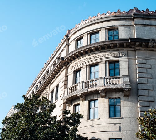 Preview: Old building with visible shadow under blue sky