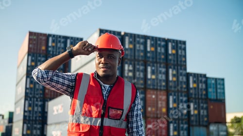 Preview: engineer foreman looking upwards towards container shipment for sharing details information