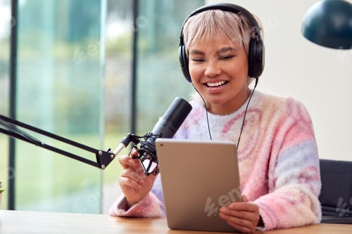 Preview: Woman Recording Podcast Or Broadcasting On Radio In Studio At Home With Digital Tablet