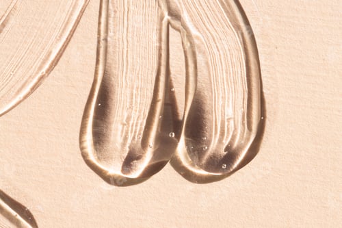 Preview: Samples of transparent cosmetic texture macro, top view. Hyaluronic gel, aloe vera, liquid serum