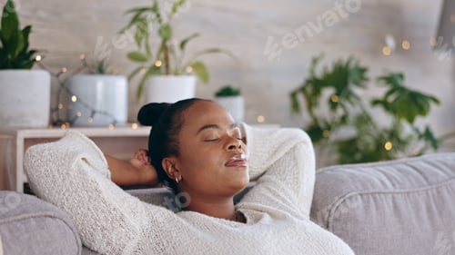 Preview: Black woman, relax and living room sofa rest with a female feeling tired in a home. Calm, resting a