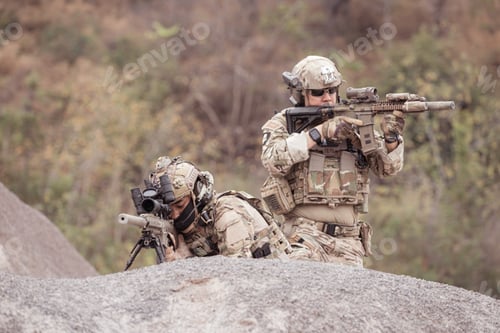Preview: Soldiers in camouflage military uniforms carrying weapons Reconnaissance missions in rugged mountain