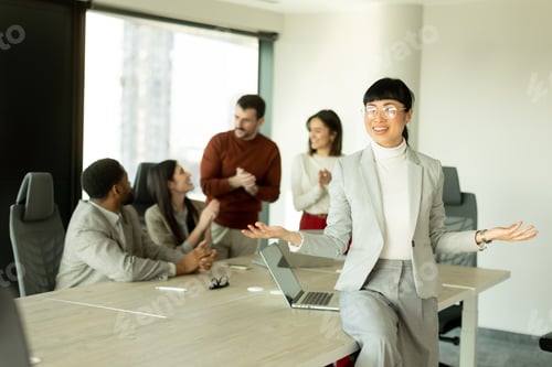 Preview: Business professionals collaborate in a modern office setting during a productive meeting session